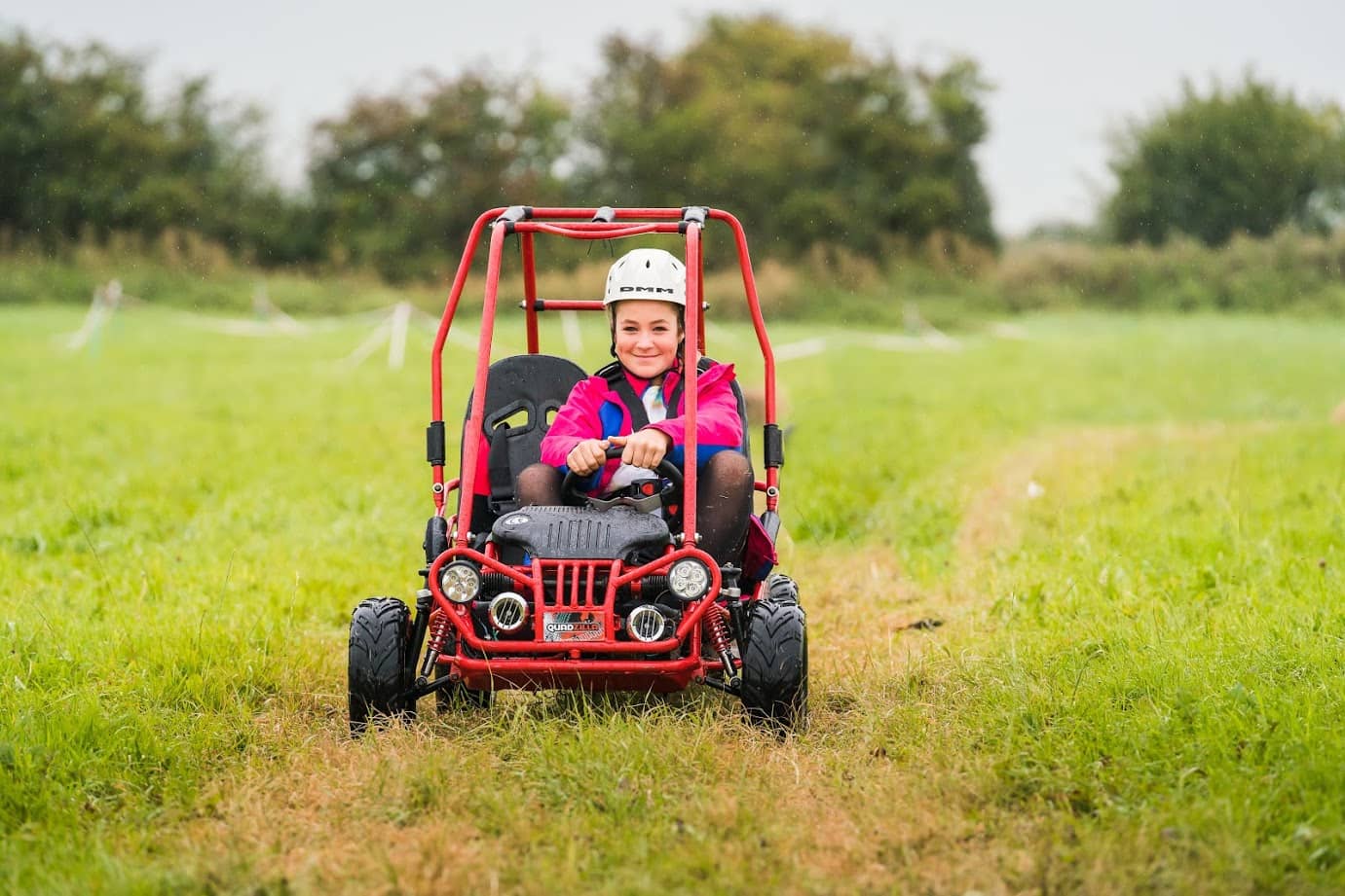 Little girl in mud buggy